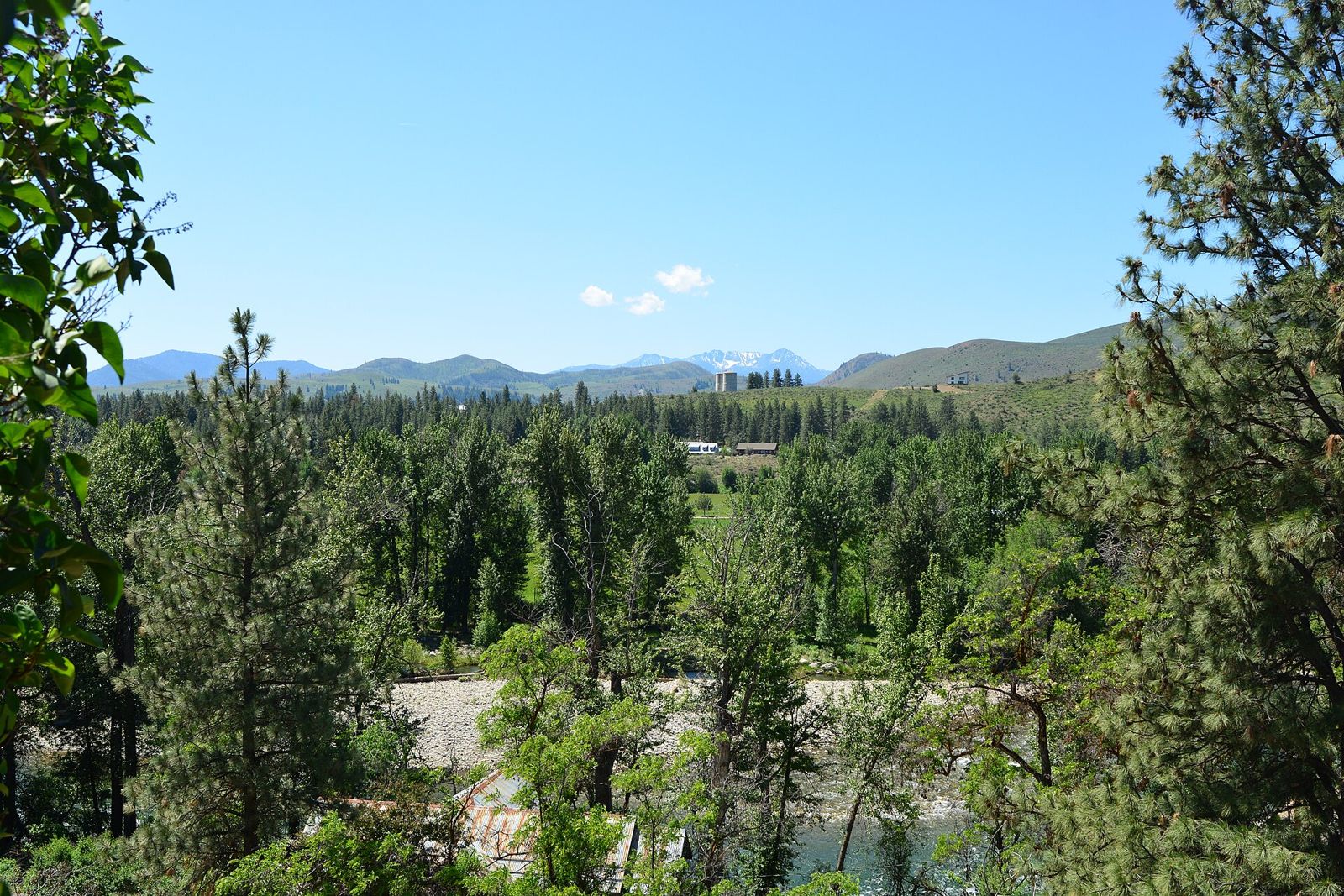 View across the Methow River toward forested hills from Winthrop